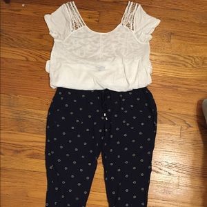 Navy blue flower print drawstring pants.